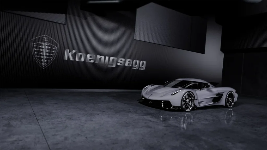 Conheça o carro mais rápido do mundo: dados oficiais e curiosidades 3 carro mais rápido do mundo - Koenigsegg Jesko Absolut em um estúdio com piso de concreto polido, sob iluminação suave e o logotipo da Koenigsegg ao fundo.